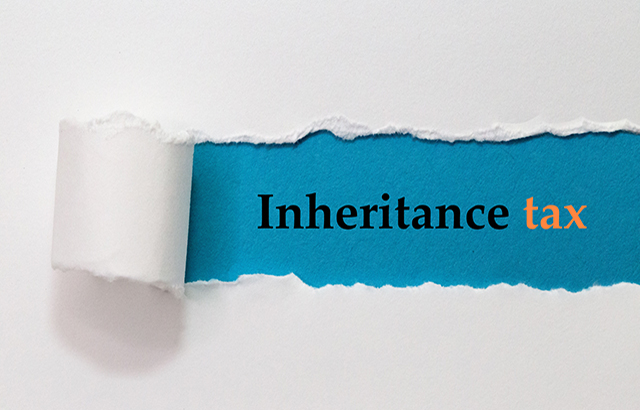 Inheritance Tax Written Under White Torn Paper