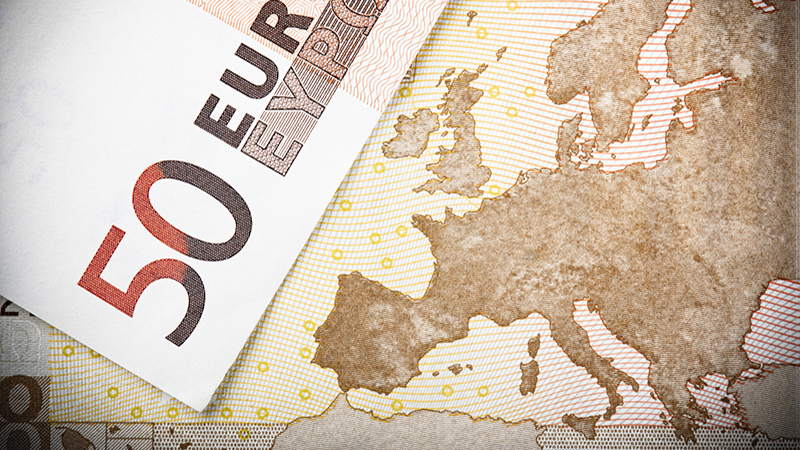 Euro notes close-up: Macro image of two €50 banknotes, with focus on the map of Europe.
