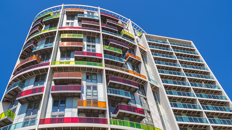 Exterior of modern apartments Meridia Court in Stratford, London, with colourful balconies