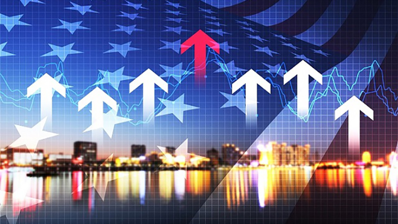 numerous white arrows and one red arrow pointing upwards against a backdrop of the stars and stripes and a city background