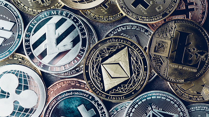 Crypto currency background with various of shiny silver and golden physical cryptocurrencies symbol coins, Bitcoin, Ethereum, Litecoin, zcash, ripple.