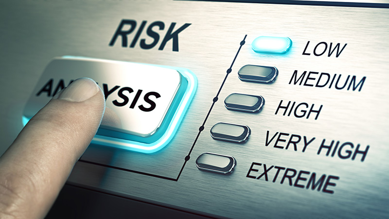 man finger about to press an analysis push button. Focus on the blue led. Concept image for illustration of risk management or assessment.