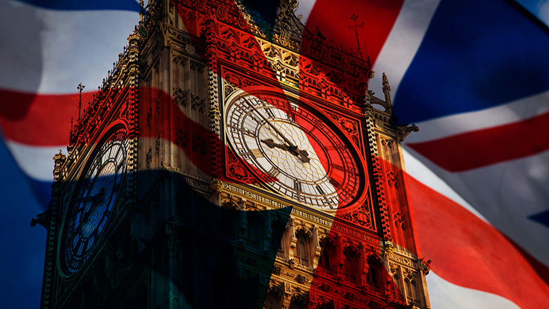 union jack flag and iconic Big Ben at the palace of Westminster, London