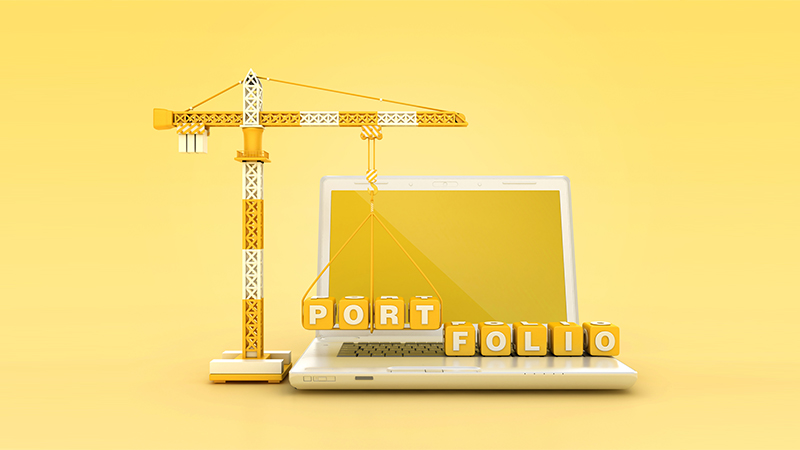 PORFOLIO Blocks with Tower Crane on Computer Laptop - Color Background - 3D Rendering