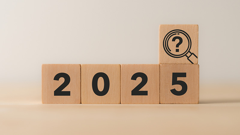 Forecasting answer, business, economy trends, opportunities, treats in 2025. New year business, economy analysis for strategic planning. 2025, magnifying glass and question mark icon on wood blocks.