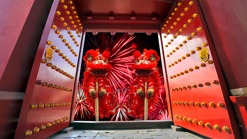 Chinese Lion Dance with firework in the background